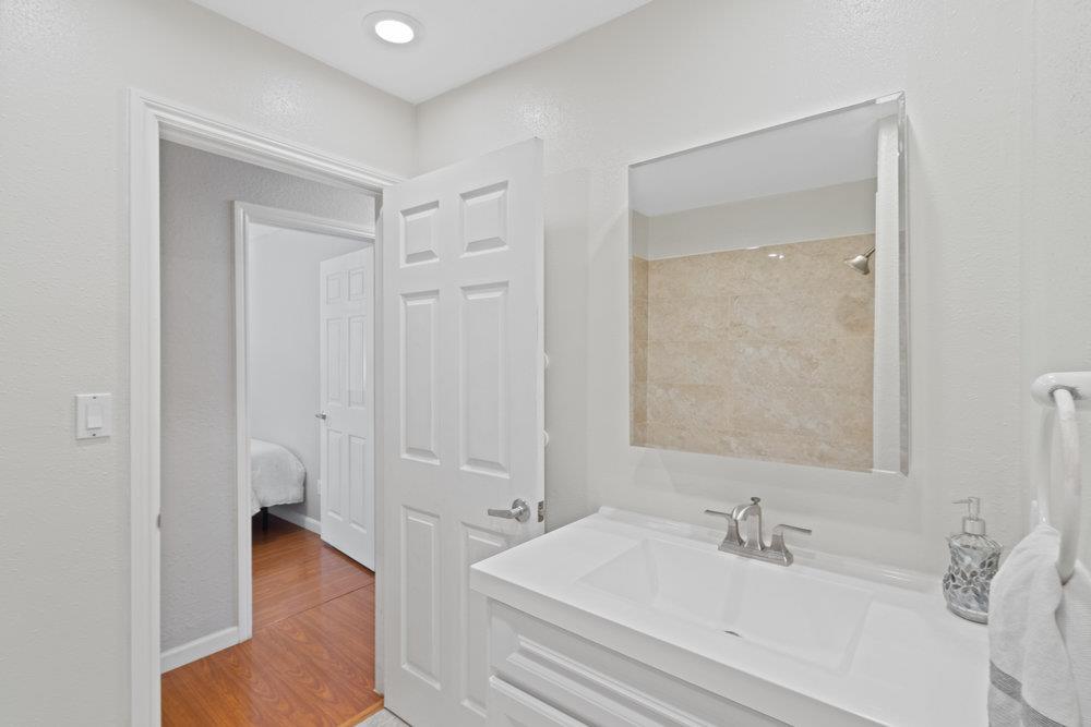 19 Jolley Way Scotts Valley, CA 95066 - Photo 31 of 56 a en suite bathroom with a sink and a mirror