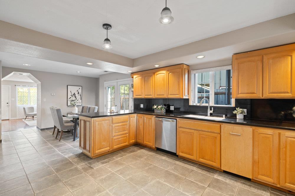 19 Jolley Way Scotts Valley, CA 95066 - Photo 9 of 56 a large kitchen with granite countertop a large counter top space a sink a window and stainless steel appliances