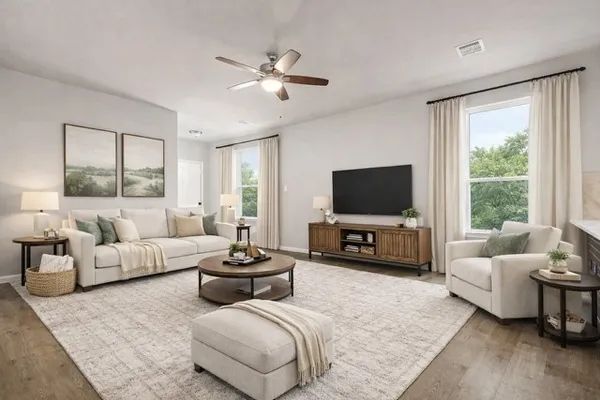 a living room with furniture and a flat screen tv