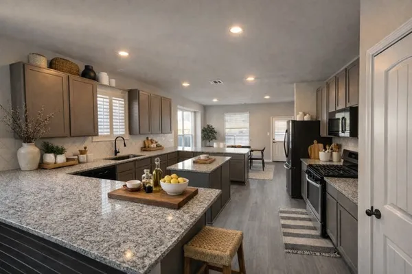 a kitchen with a refrigerator sink and microwave