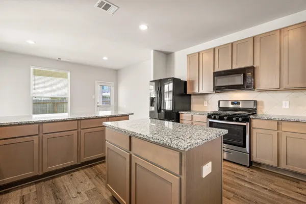 a view of a dining room with furniture and window
