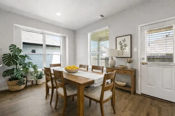 a view of kitchen with kitchen island and stainless steel appliances