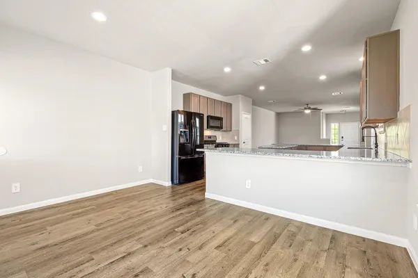 a view of front door with wooden floor