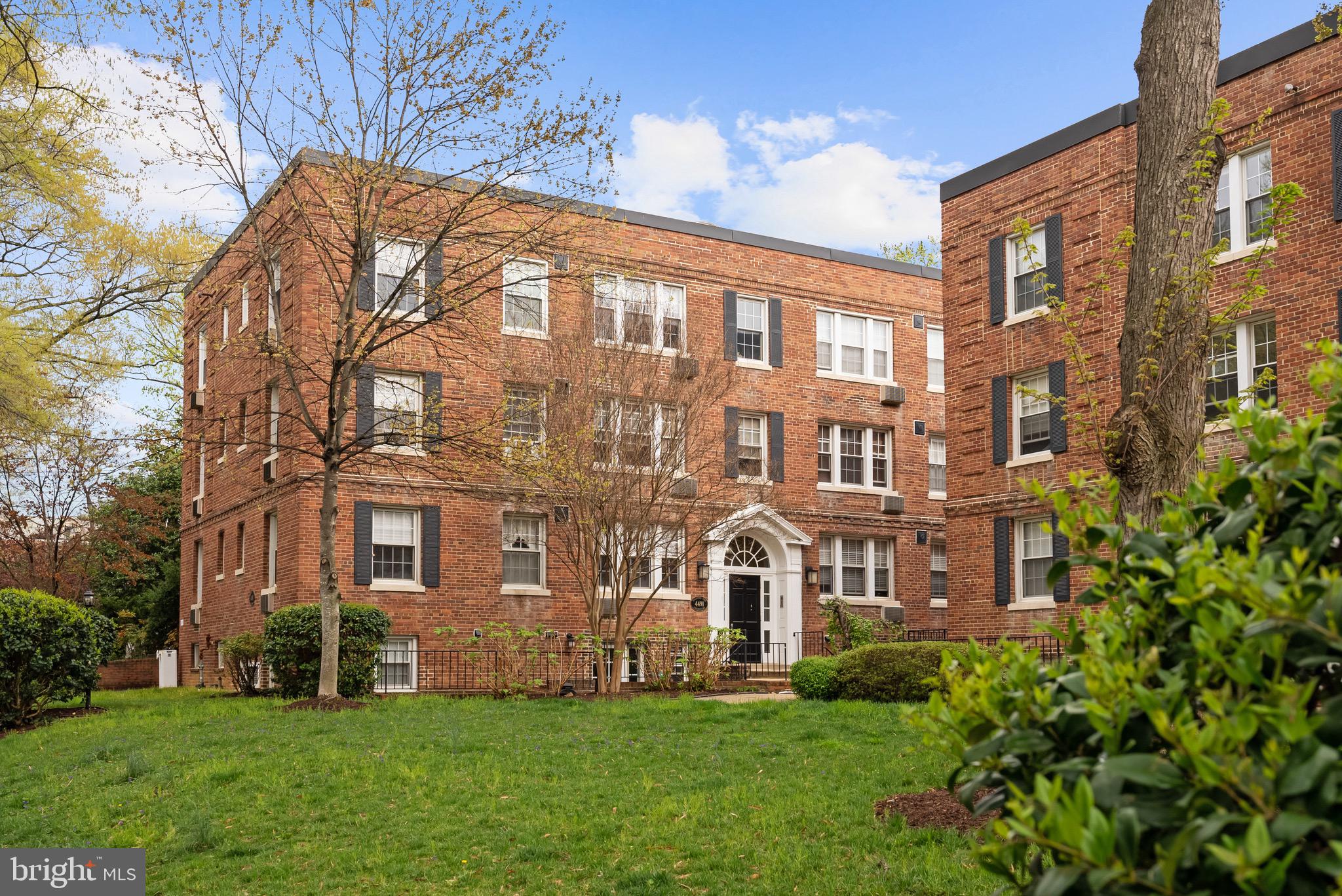 a view of a building with a yard