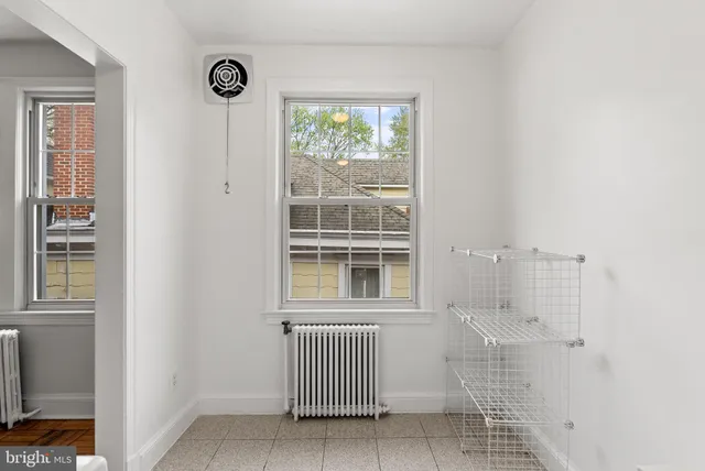 a view of an empty room with a window