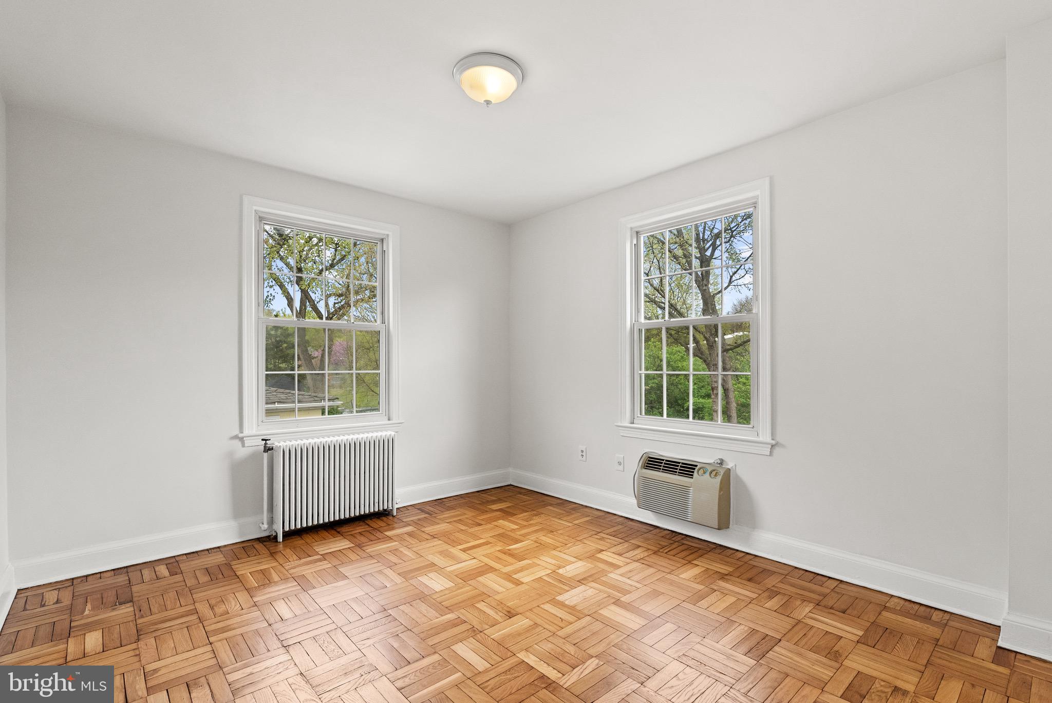 4491 MacArthur Boulevard Northwest, Unit 303 Washington, DC 20007 - Photo 20 of 37 an empty room with windows
