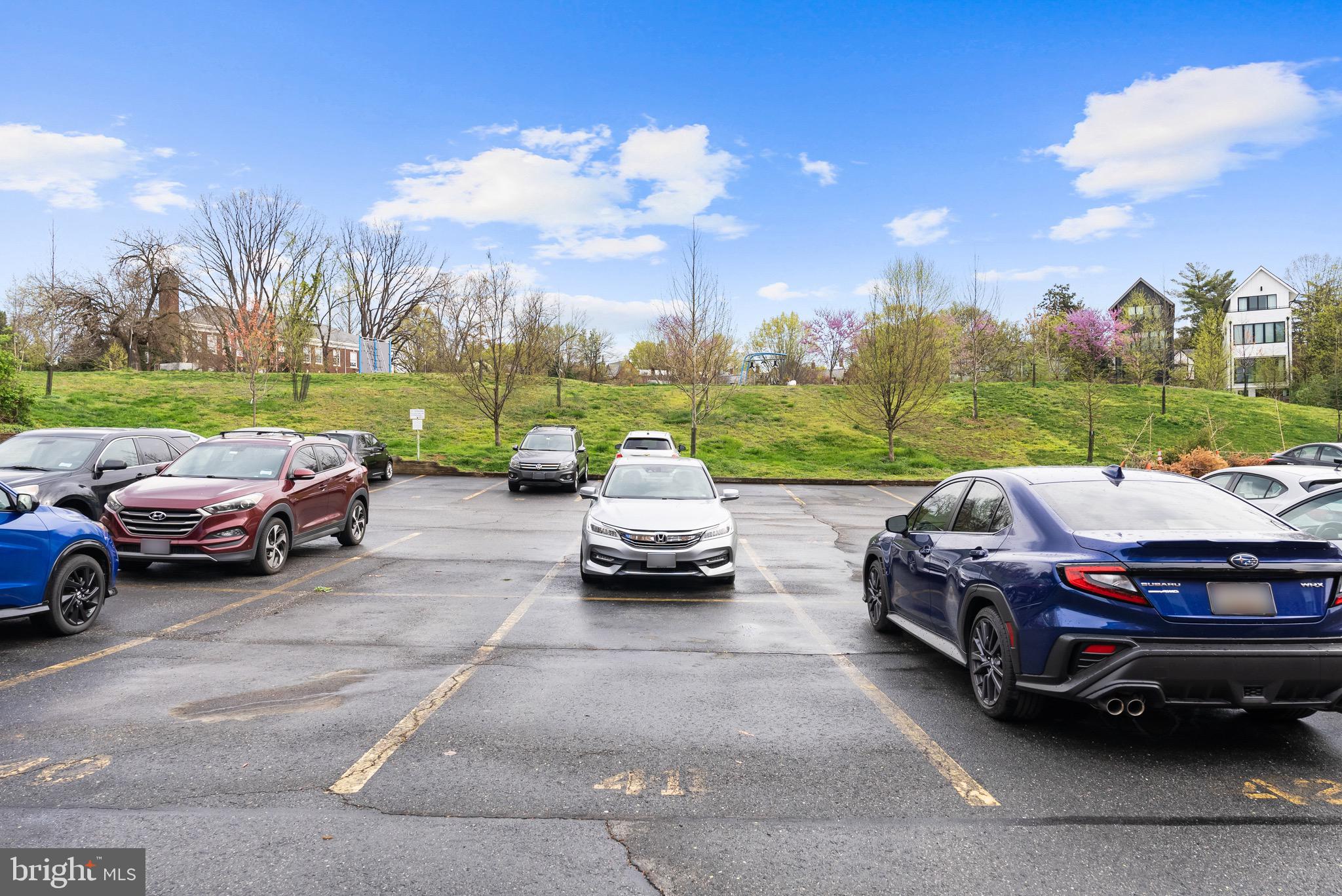 4491 MacArthur Boulevard Northwest, Unit 303 Washington, DC 20007 - Photo 26 of 37 a car parked in the yard