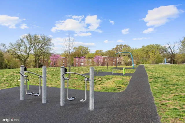 a view of outdoor space with playground and green space