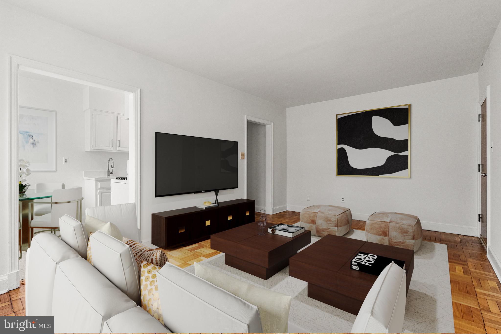 4491 MacArthur Boulevard Northwest, Unit 303 Washington, DC 20007 - Photo 4 of 37 a living room with couches and a flat screen tv