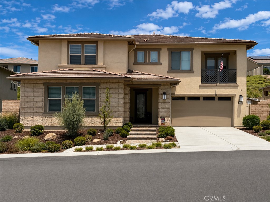 a front view of a house with yard