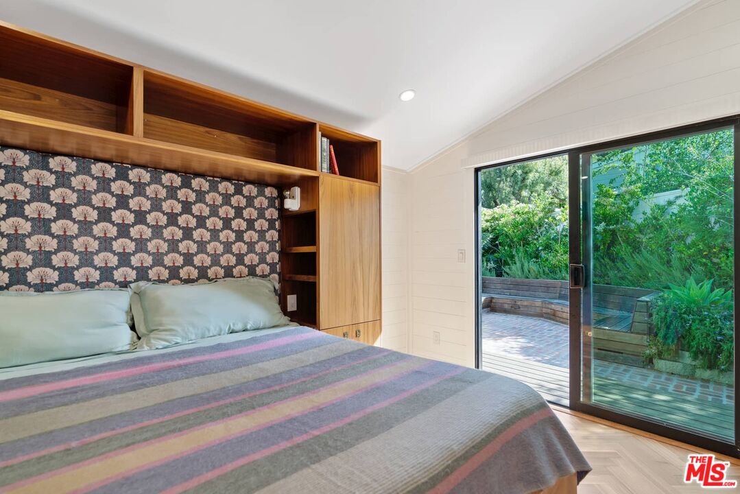249 Paradise Cove Road Malibu, CA 90265 - Photo 21 of 41 a bedroom with a bed and mirror
