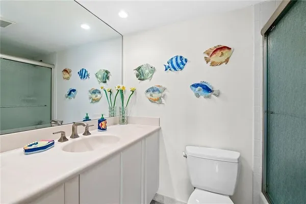 a dining room with furniture a chandelier and window