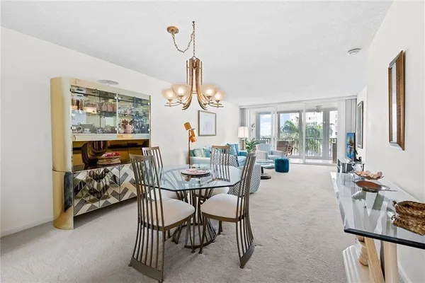 a living room with furniture and a lamp