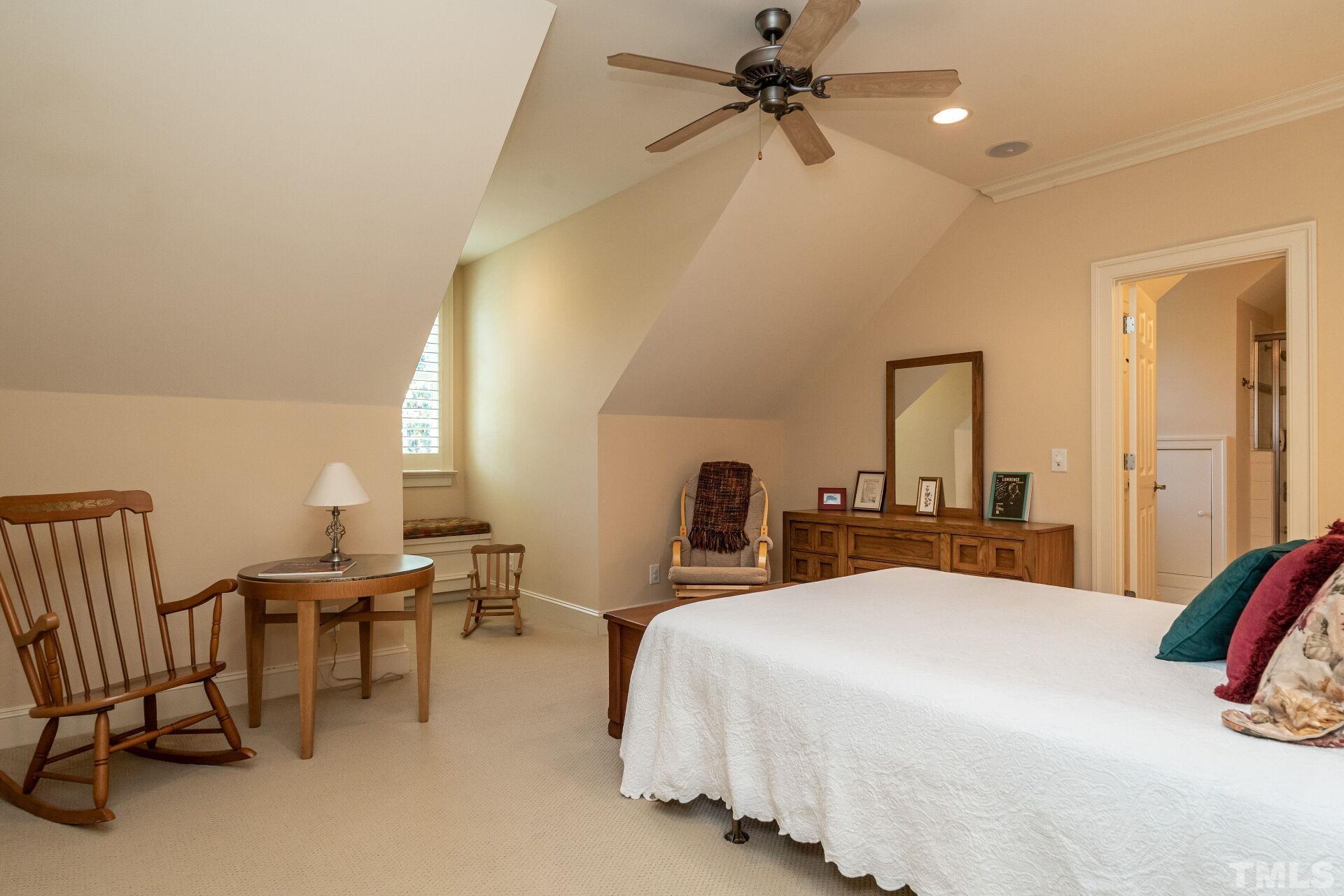 3120 Darien Drive Raleigh, NC 27607 - Photo 31 of 55 a bedroom with double bed and a chandelier