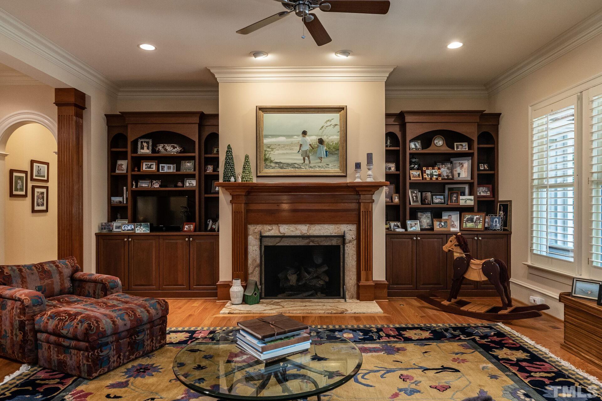 3120 Darien Drive Raleigh, NC 27607 - Photo 8 of 55 a living room with furniture a window and a fireplace