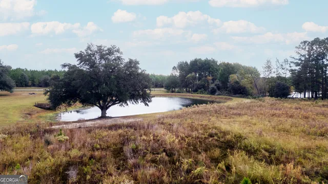 a view of a house with a backyard porch and sitting area
