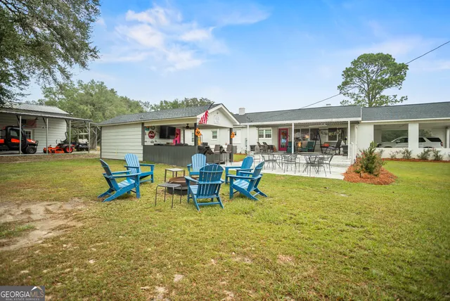 a view of outdoor space with yard and trees in the background