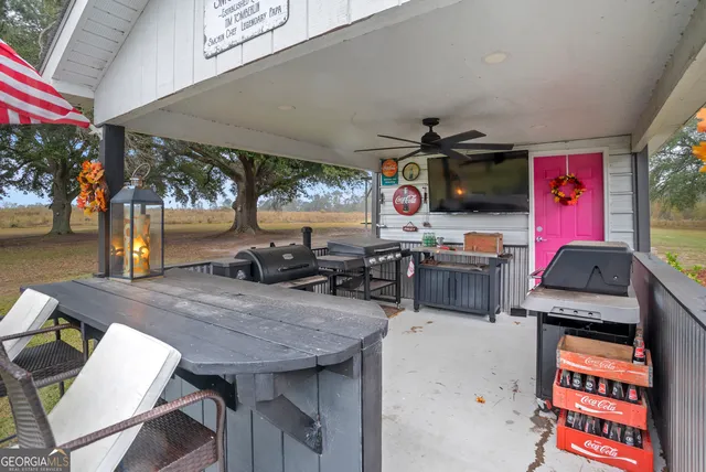 a living room with fireplace furniture and a wooden floor