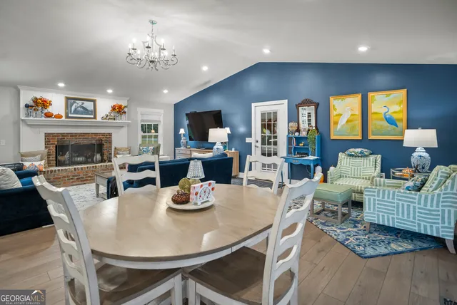 a kitchen with stainless steel appliances a refrigerator and a stove top oven