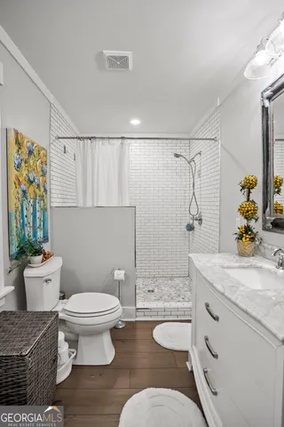 a view of a lake with a big yard and potted plants