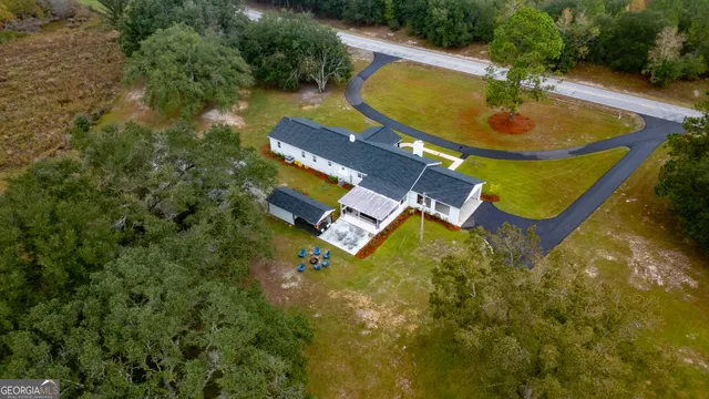 an aerial view of residential houses with outdoor space