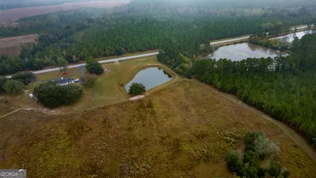a front view of a house with a big yard