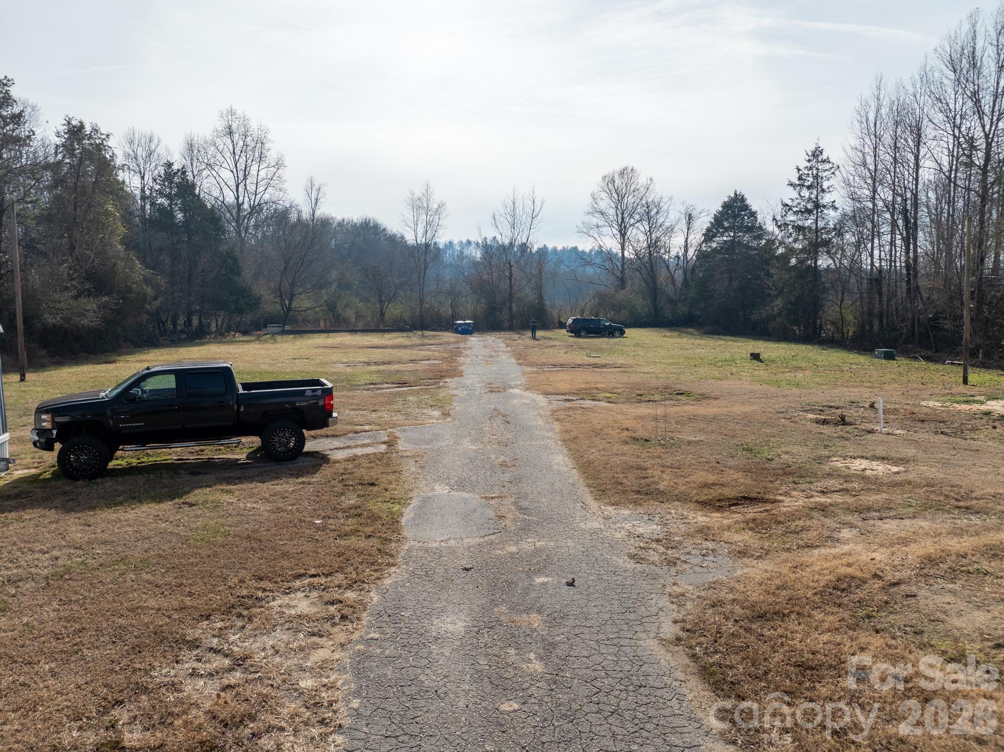 3036 Highway 18 Morganton, NC 28655 - Photo 15 of 28 a view of a yard with a car parked on the road