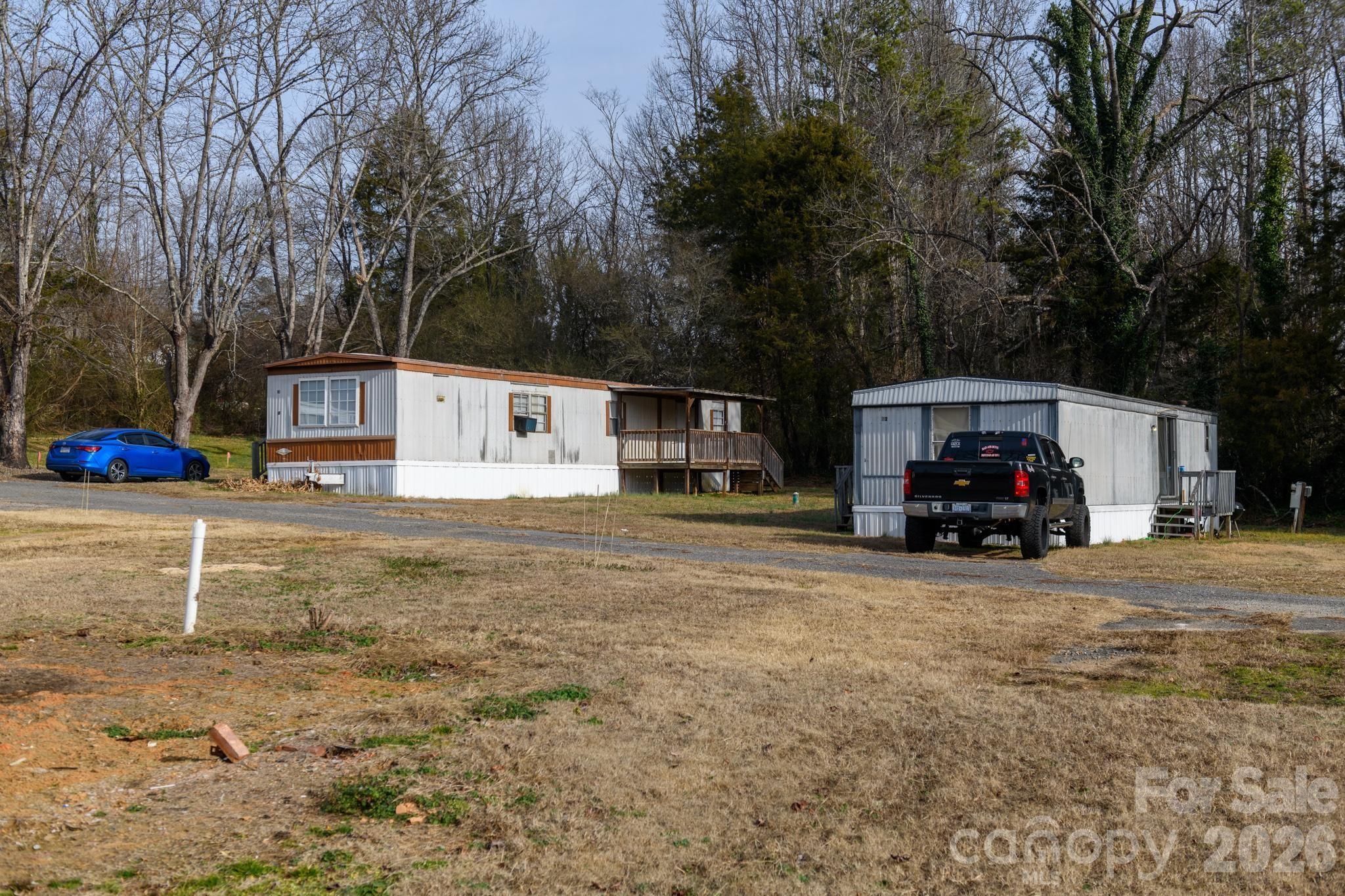 3036 Highway 18 Morganton, NC 28655 - Photo 19 of 28 a view of a house with truck parked on the road