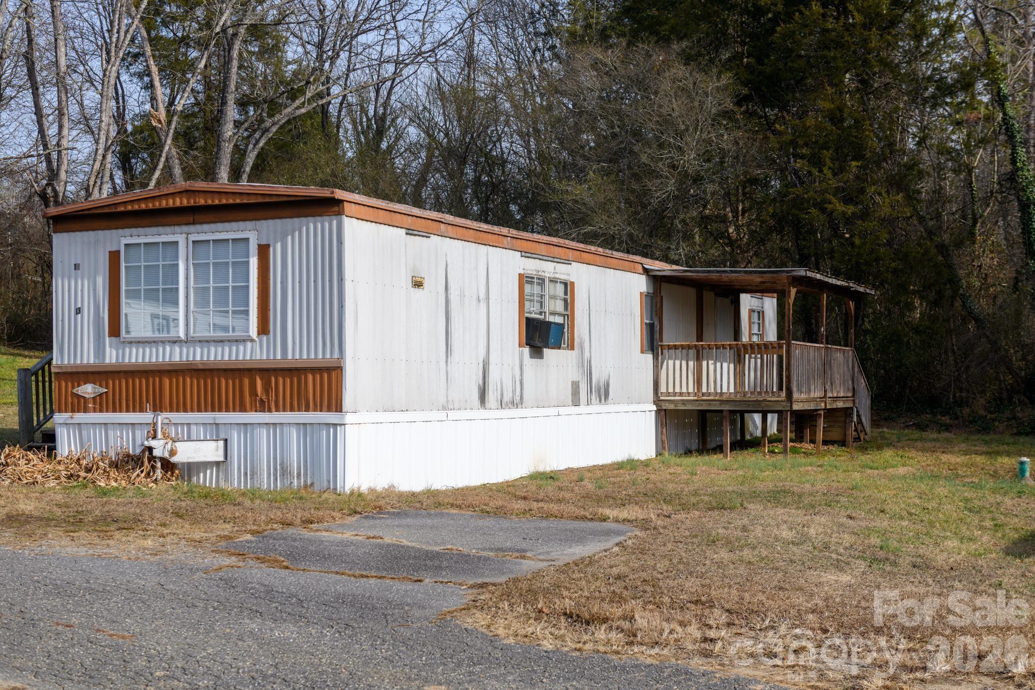 3036 Highway 18 Morganton, NC 28655 - Photo 22 of 28 a view of a house with a large window and wooden fence