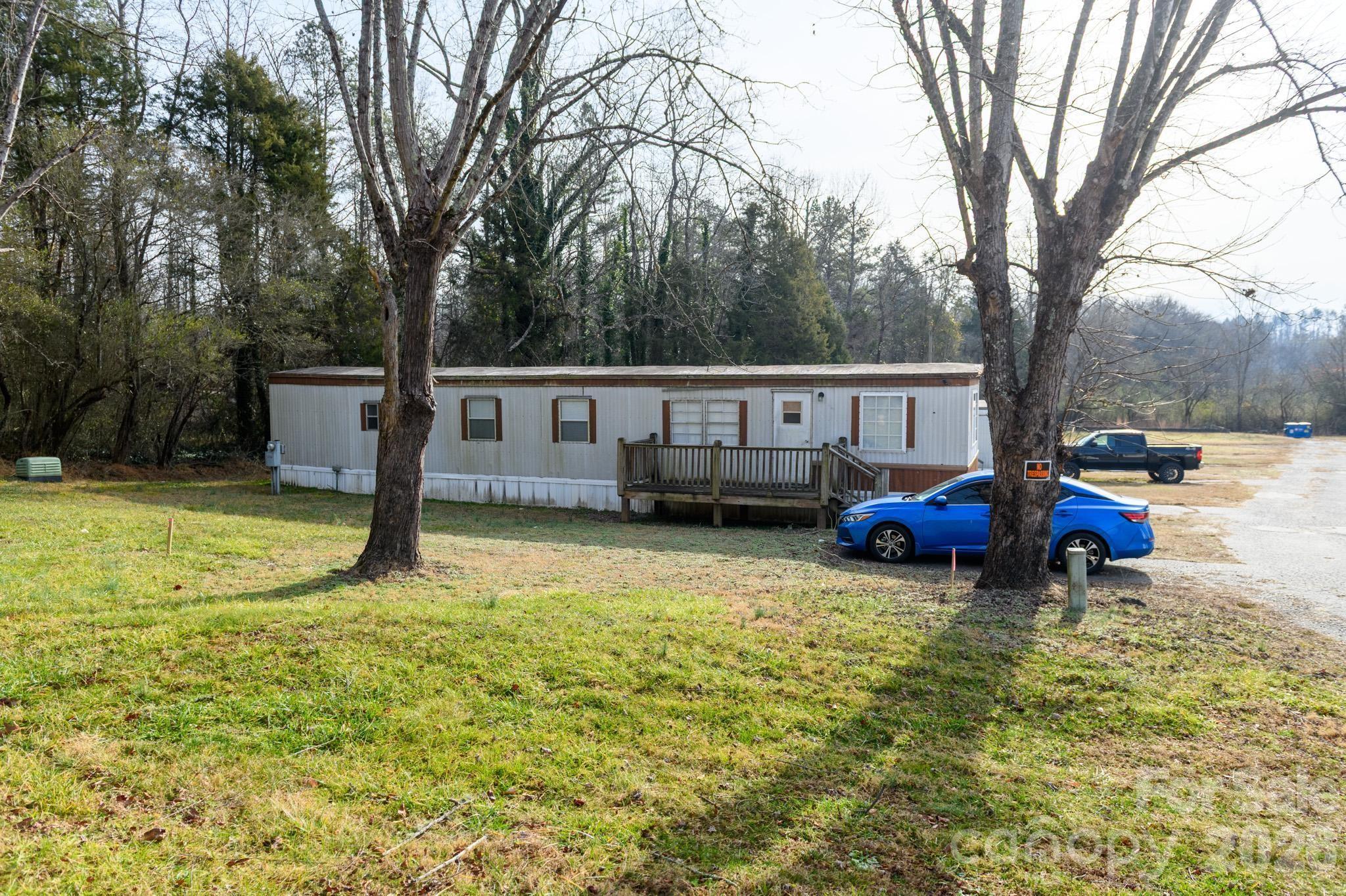 3036 Highway 18 Morganton, NC 28655 - Photo 26 of 28 a view of a house with swimming pool and sitting area