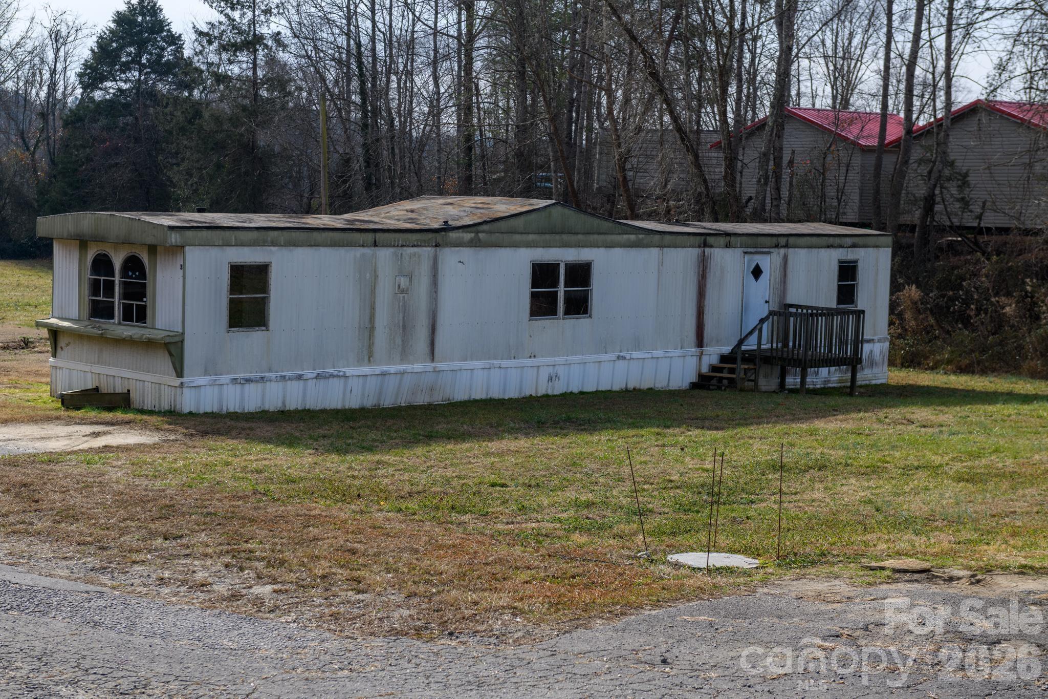 3036 Highway 18 Morganton, NC 28655 - Photo 27 of 28 a view of a house with a yard