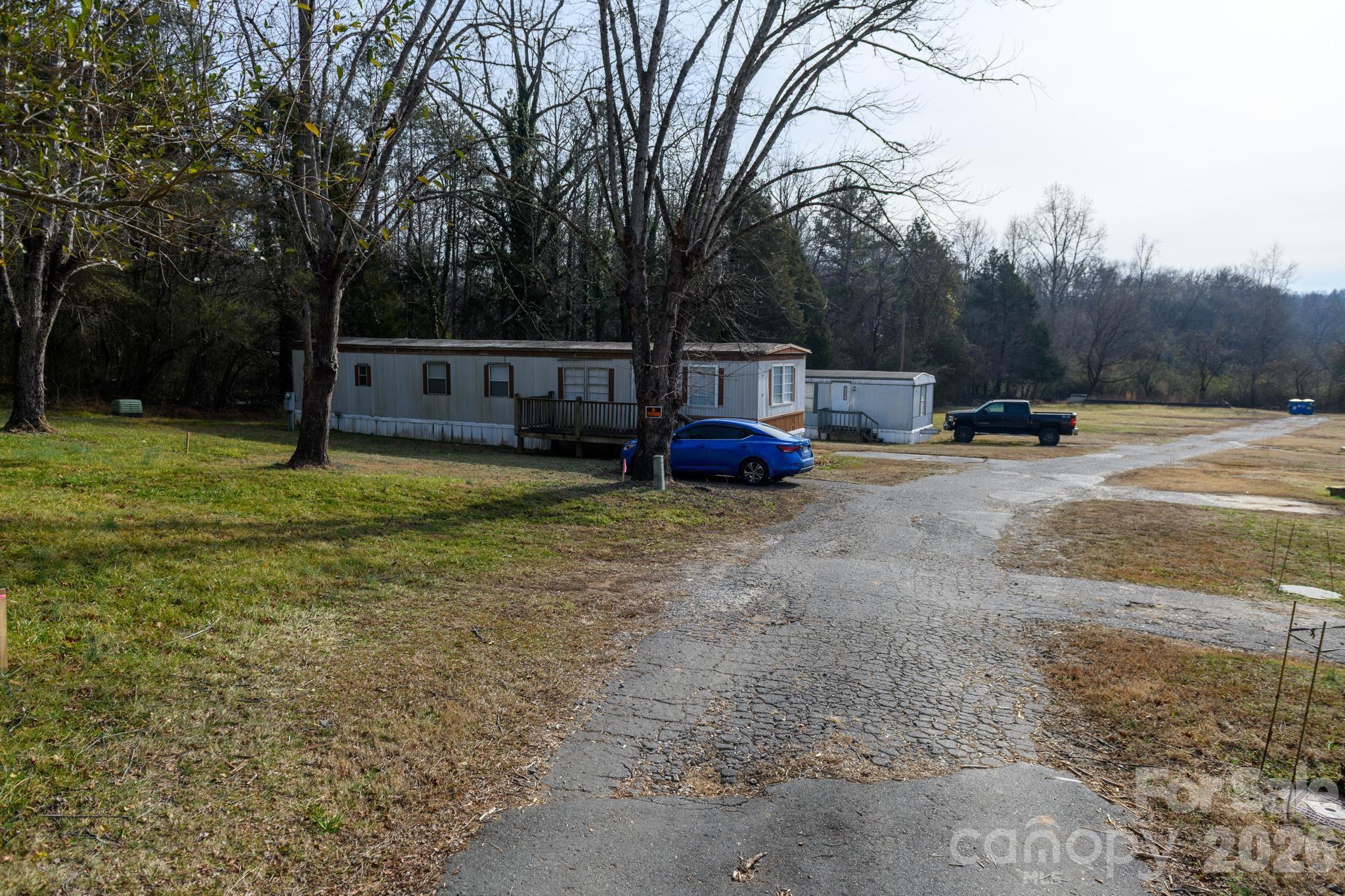 3036 Highway 18 Morganton, NC 28655 - Photo 7 of 28 a view of a house with backyard and trees