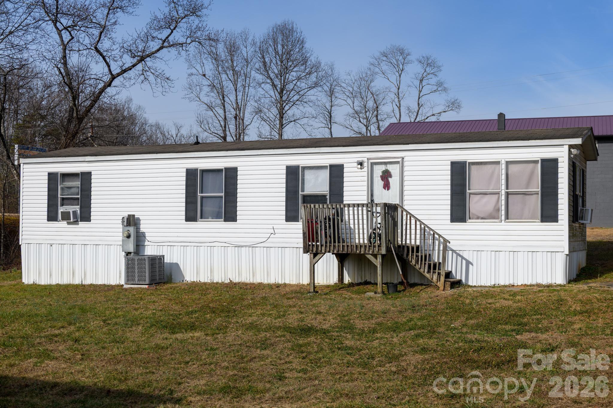 3036 Highway 18 Morganton, NC 28655 - Photo 8 of 28 a view of a house with backyard and sitting area