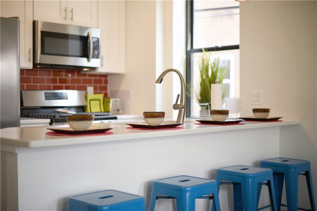 103 57th Street Pittsburgh, PA 15201 - Photo 11 of 49 a bathroom with a double vanity sink and a mirror