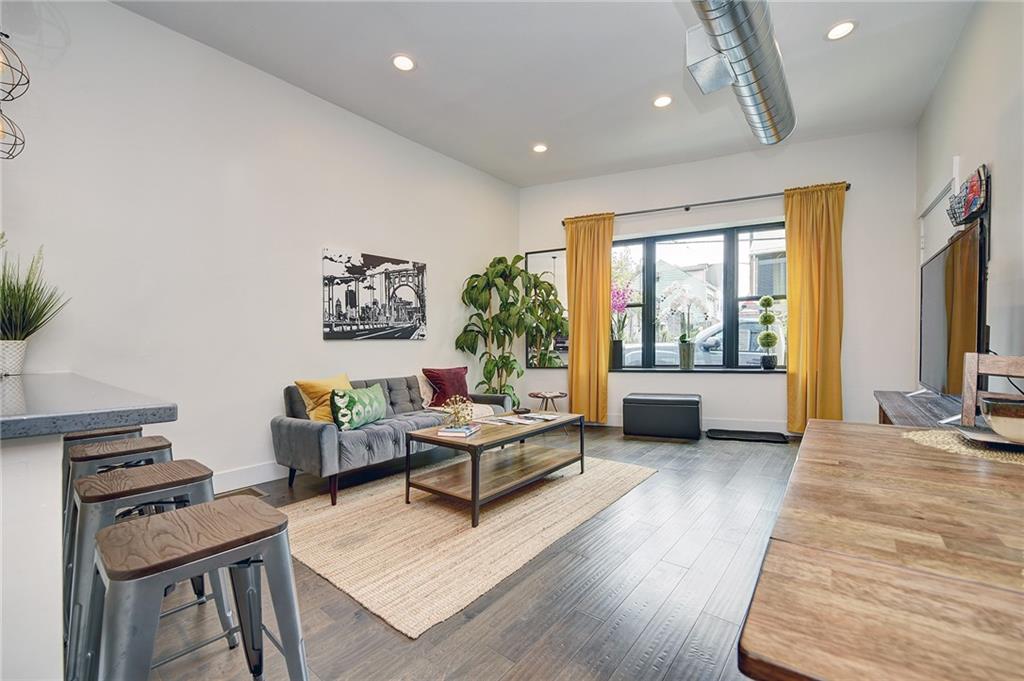 103 57th Street Pittsburgh, PA 15201 - Photo 24 of 49 a living room with furniture and a flat screen tv
