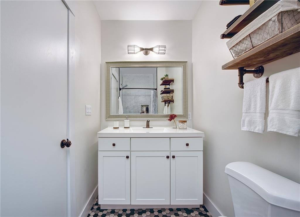 103 57th Street Pittsburgh, PA 15201 - Photo 34 of 49 a bathroom with a sink toilet and mirror