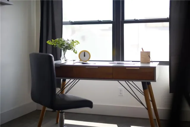 a view of a dining room with furniture and window