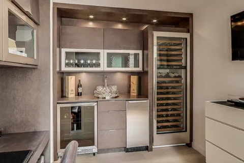 a room with cabinets and has wooden floor