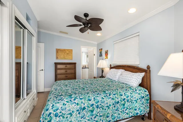 a bedroom with a bed and a closet