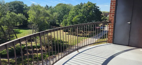 a view of balcony and yard