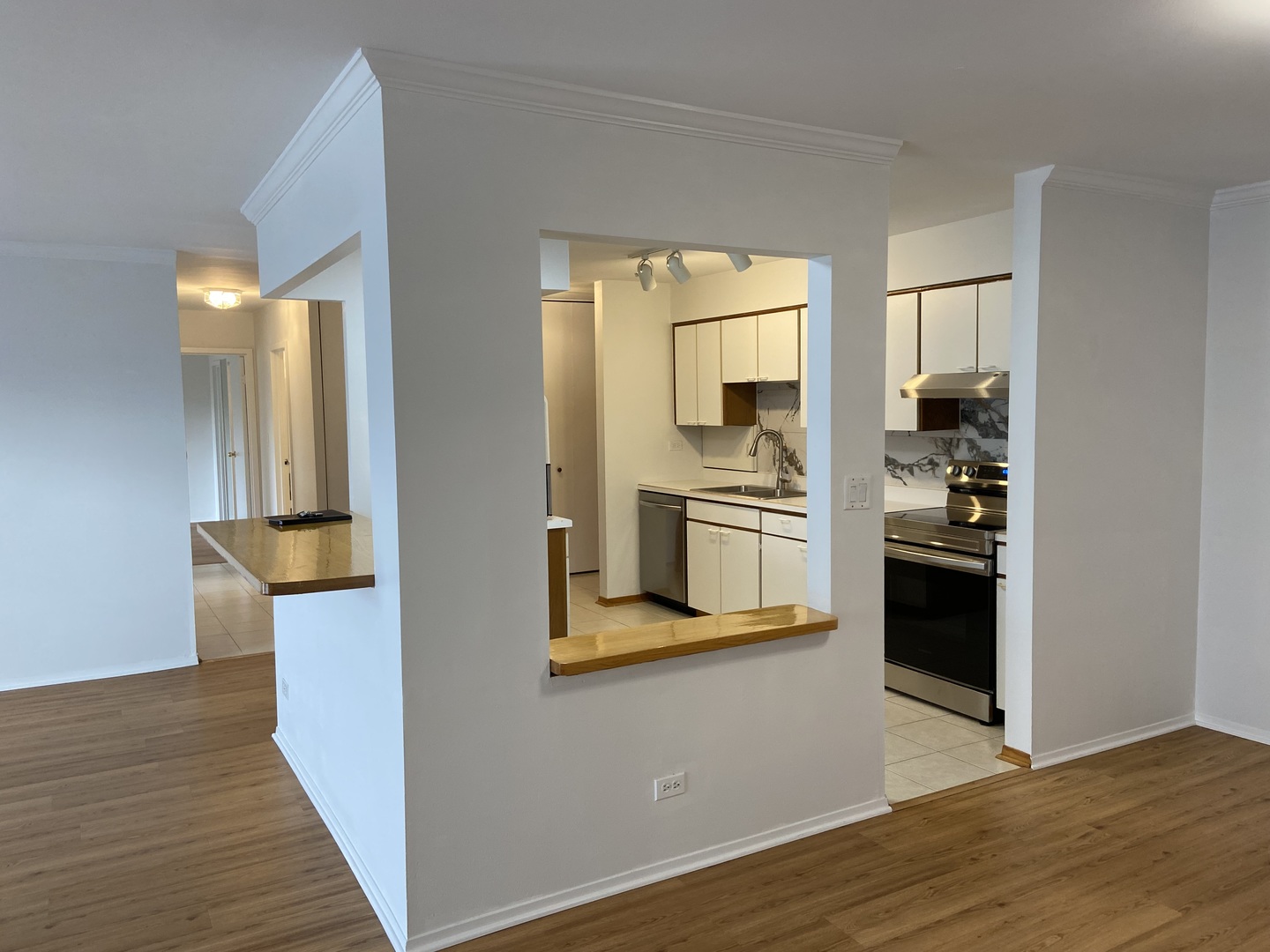 1605 East Central Road, Unit 410B Arlington Heights, IL 60005 - Photo 2 of 18 a view of a kitchen cabinets and wooden floor