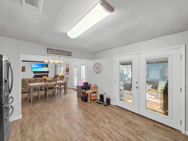 a view of a livingroom with furniture and a window