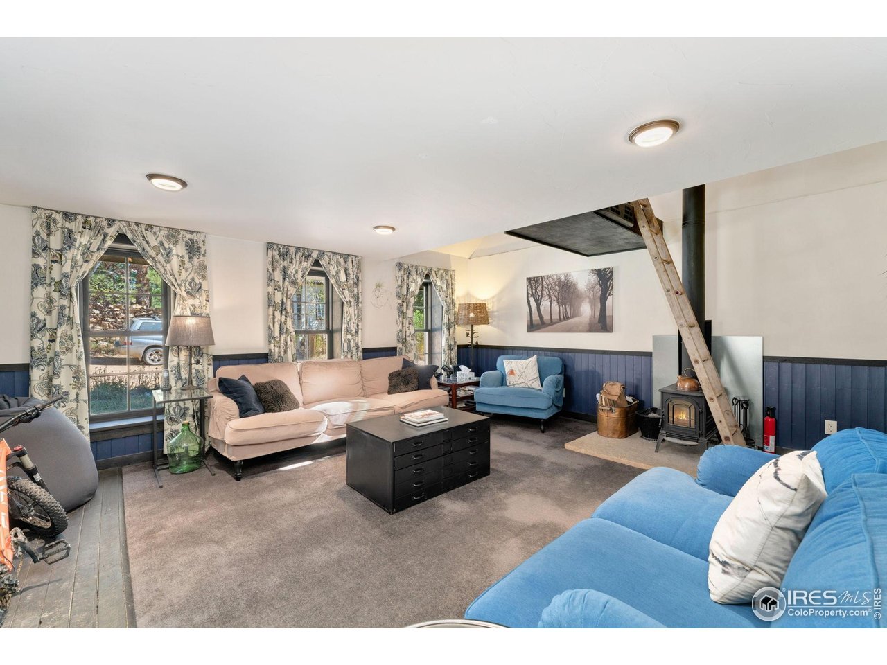 501 Main Street Boulder, CO 80302 - Photo 11 of 45 a living room with furniture and a large window