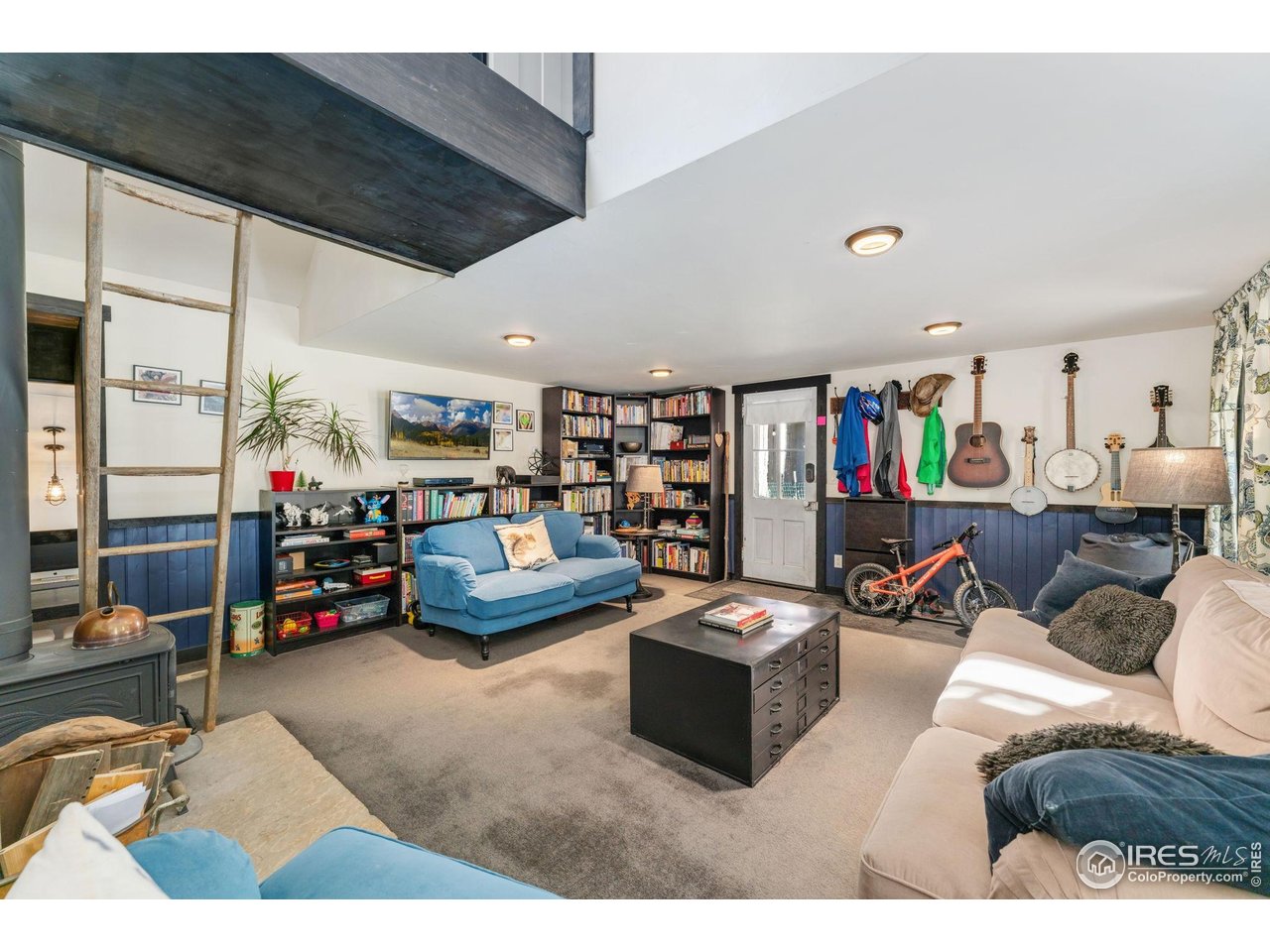 501 Main Street Boulder, CO 80302 - Photo 13 of 45 a living room with lots of furniture and a flat screen tv