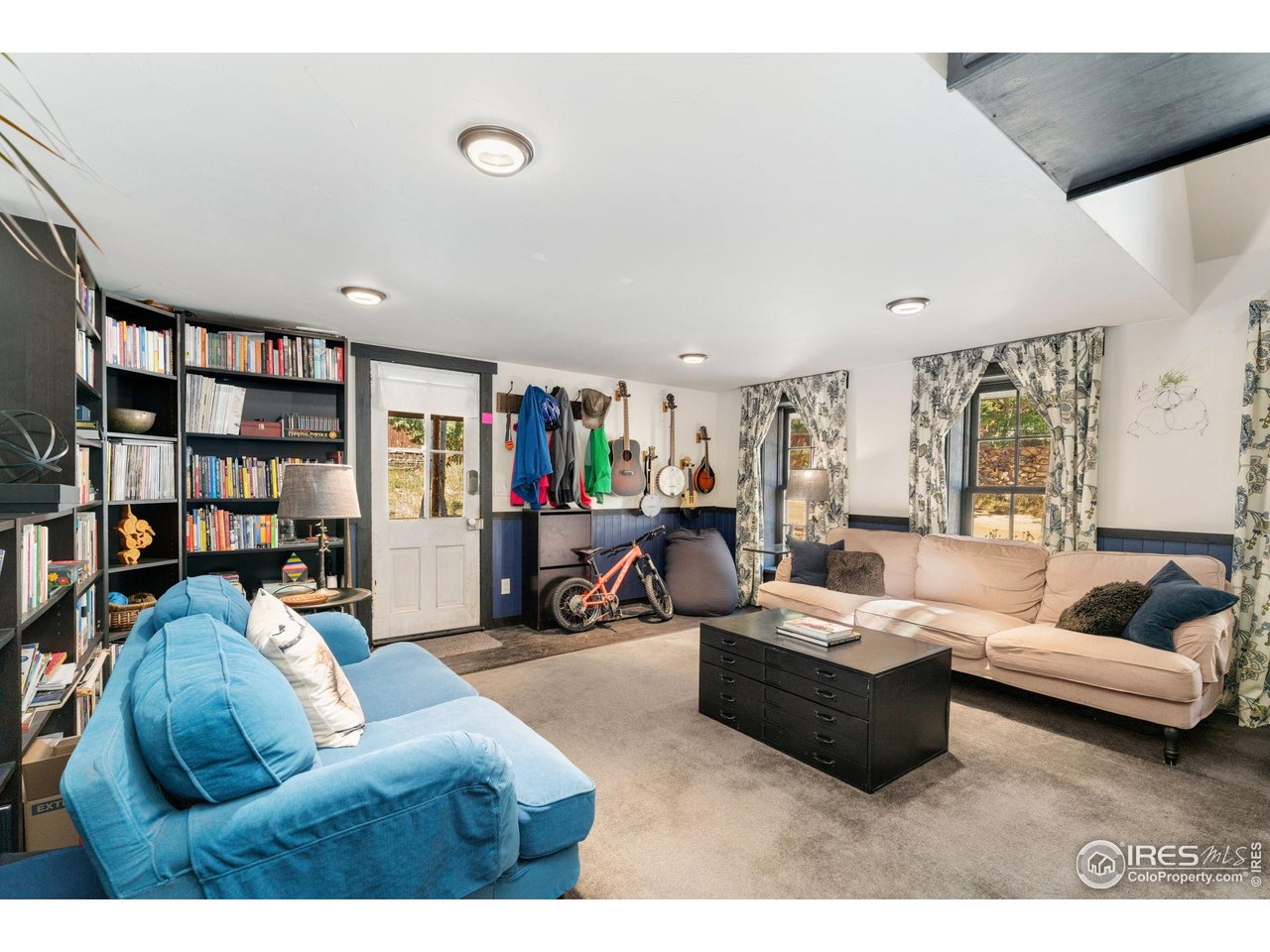 501 Main Street Boulder, CO 80302 - Photo 14 of 45 a living room with furniture and a book shelf