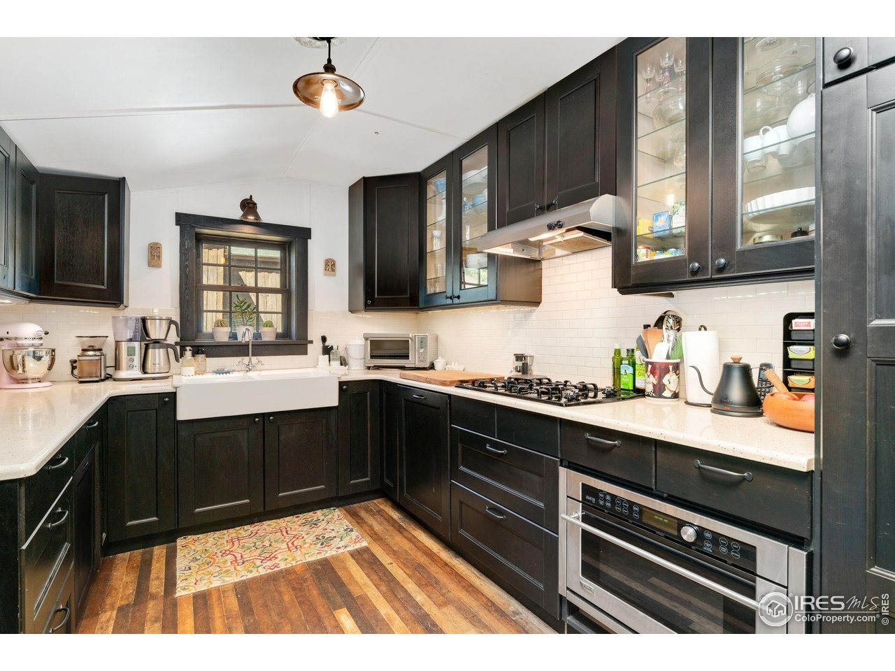 501 Main Street Boulder, CO 80302 - Photo 6 of 45 a kitchen with a sink appliances and cabinets