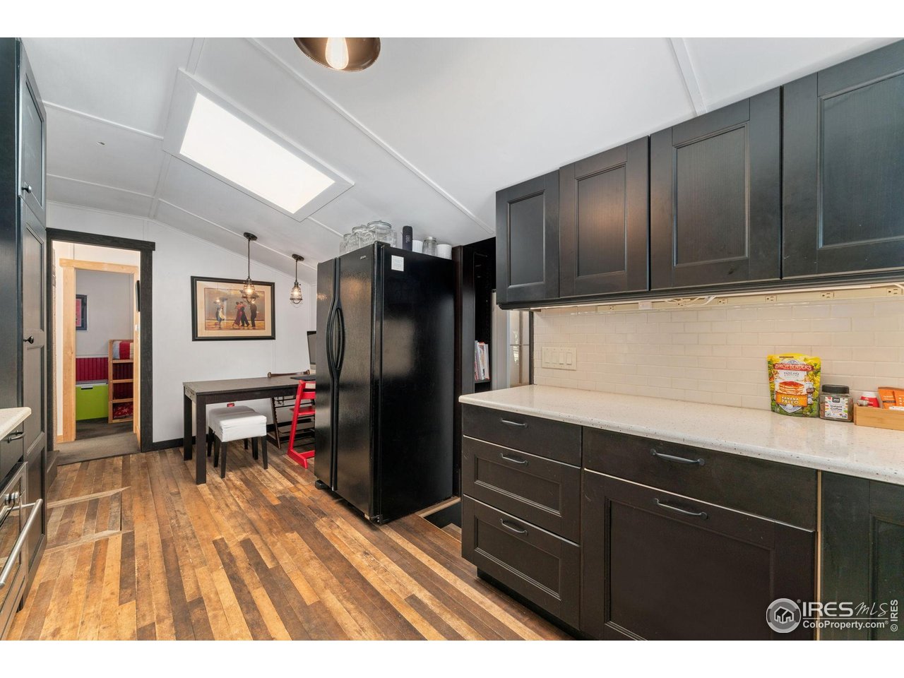 501 Main Street Boulder, CO 80302 - Photo 10 of 45 a kitchen view with wooden cabinets a refrigerator and a sink