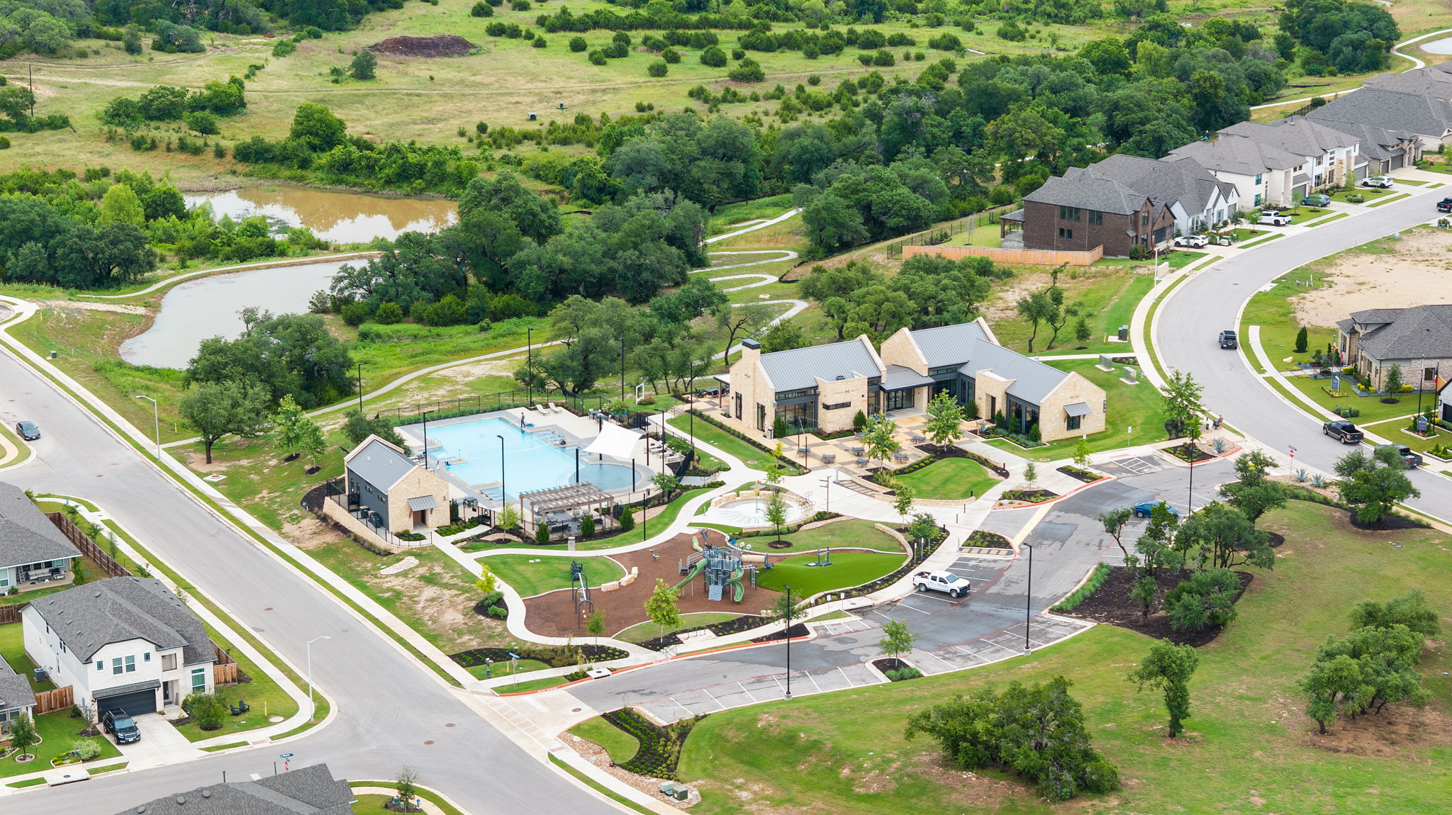 515 Watershield Cove Georgetown, TX 78633 - Photo 39 of 40 An aerial perspective reveals a vibrant community with recreational amenities and natural surroundings.