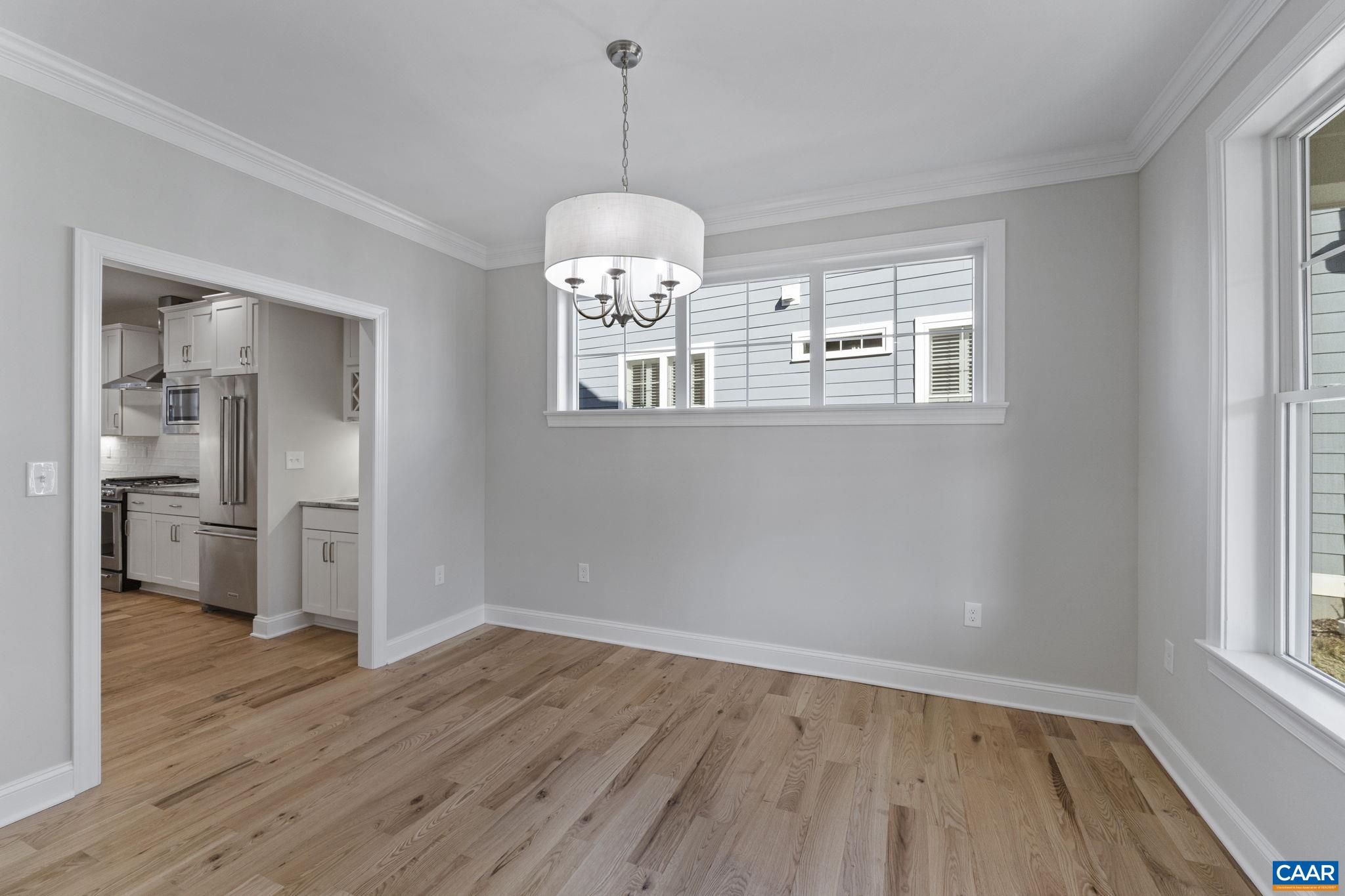 2230 Fowler Circle Charlottesville, VA 22901 - Photo 14 of 58 a view of a room with wooden floor chandelier and windows