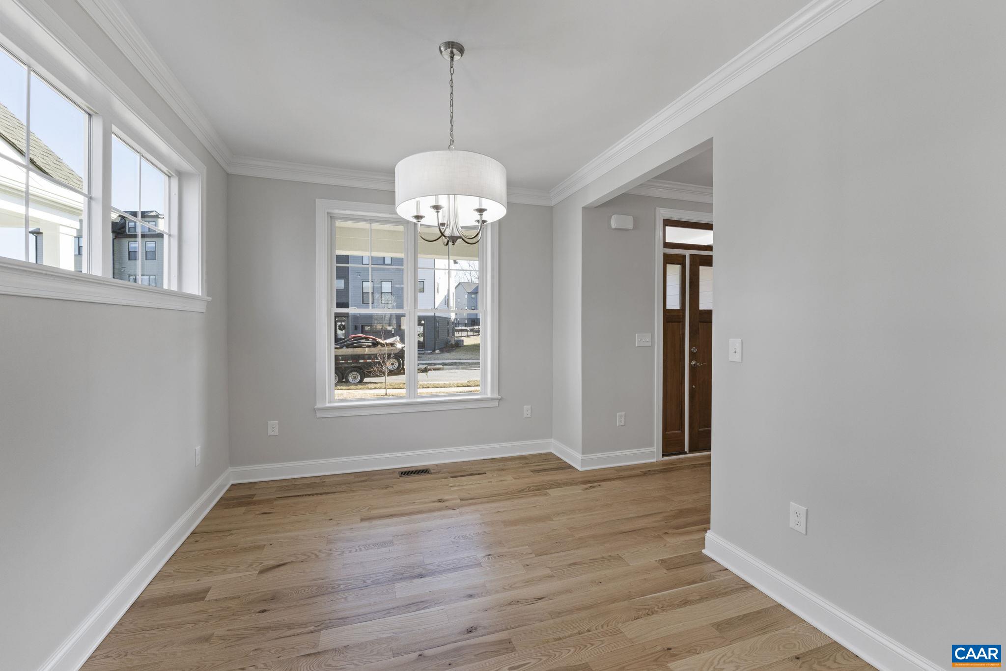2230 Fowler Circle Charlottesville, VA 22901 - Photo 15 of 58 a view of an empty room with wooden floor and a window